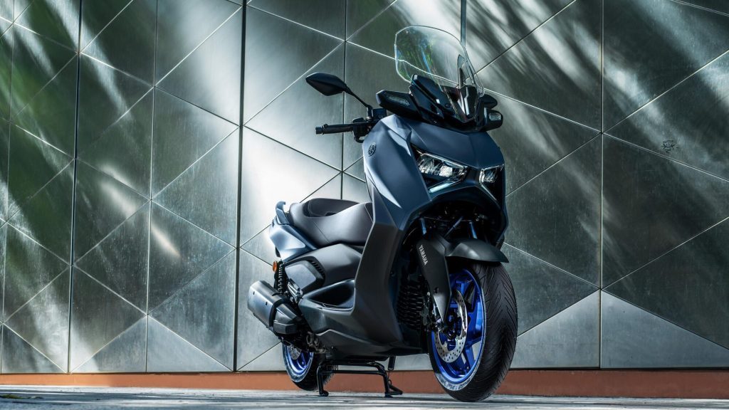 Yamaha Xmax in front of wall