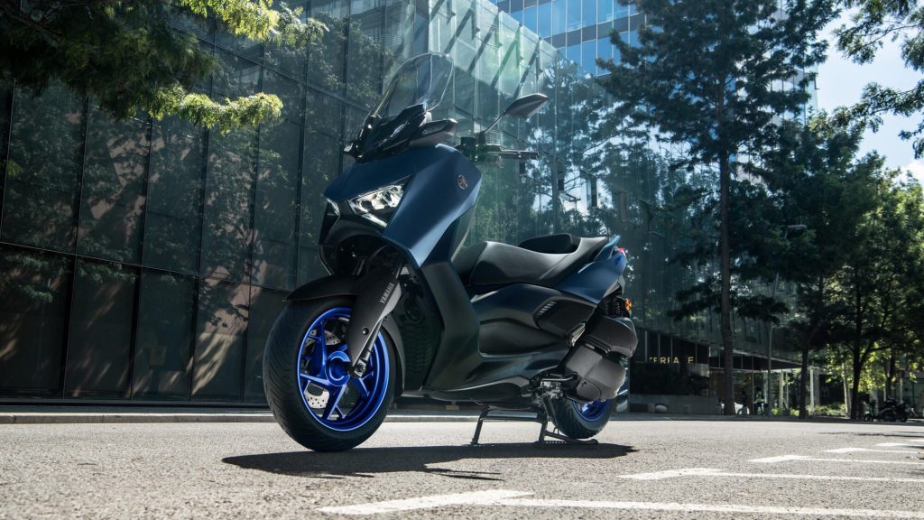 Yamaha Xmax parked in front of building