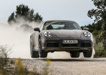 Porsche 911 Dakar jumping on dirt road