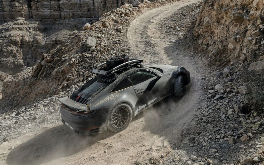 Porsche 911 Dakar driving along rocky road