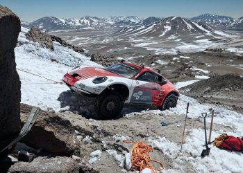 Porsche 911 off-road front three quarter view on volcano