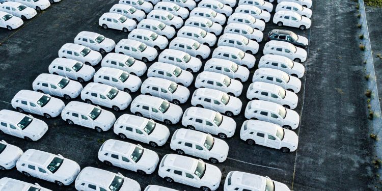 Audis parked under covers