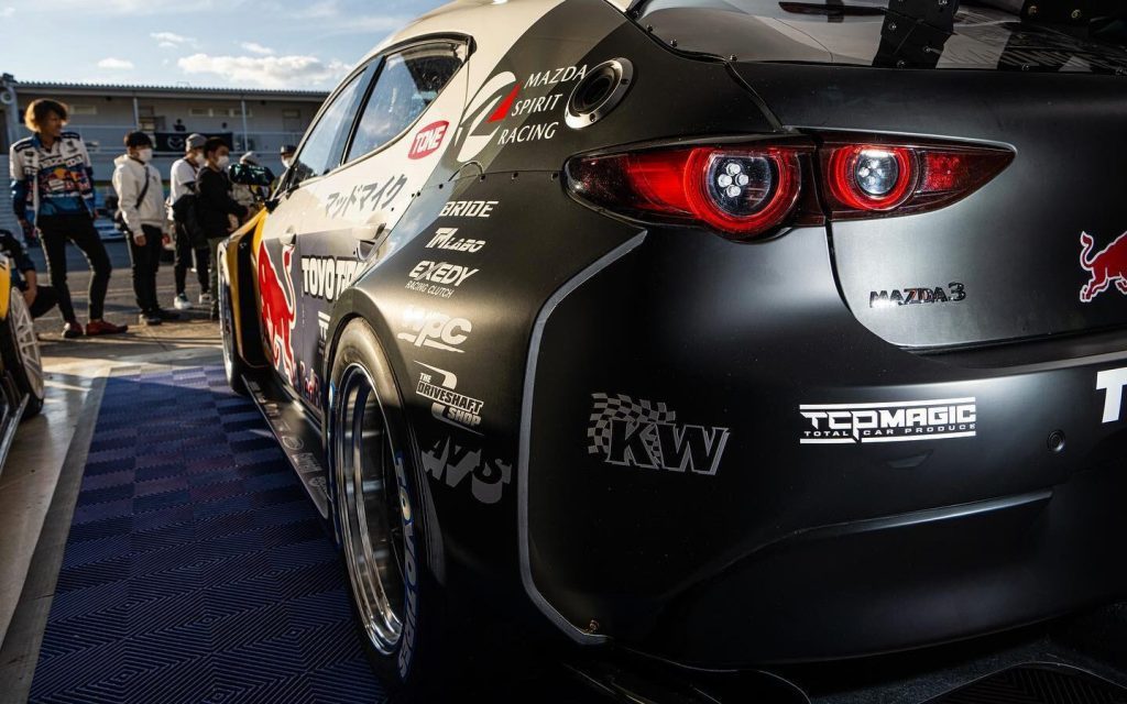 Mad Mike Whiddett's Mazda3 hillclimb car rear quarter close up view