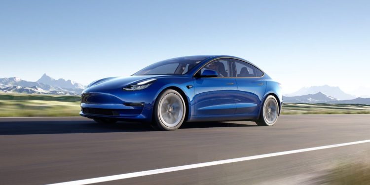 Tesla Model 3 front three quarter view driving