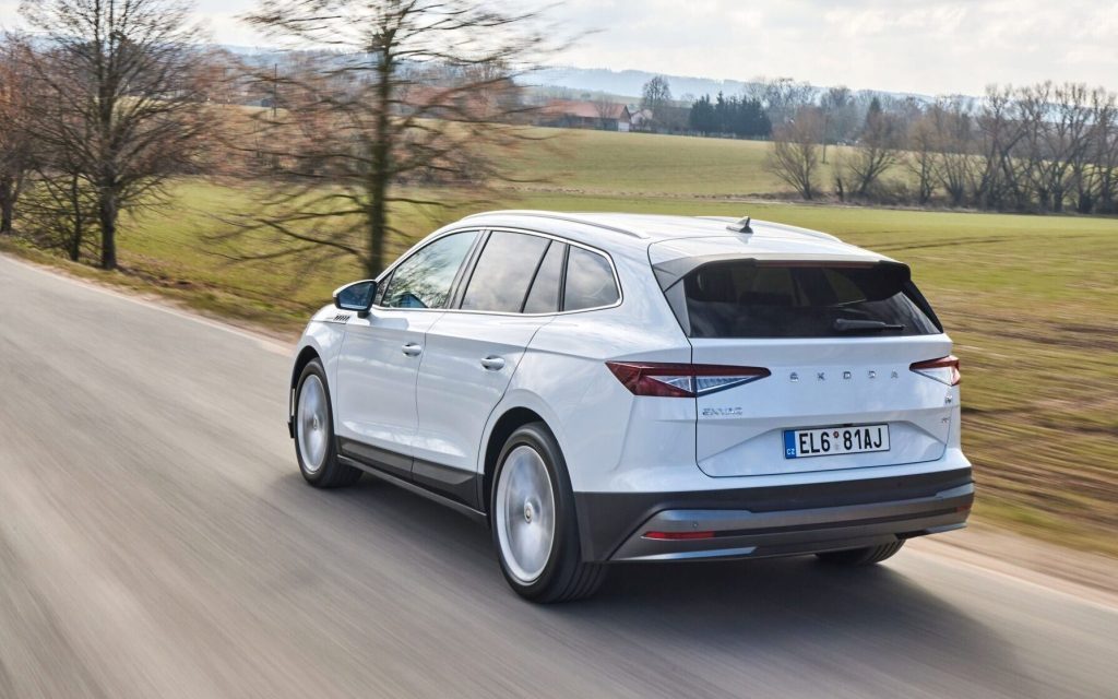 Skoda Enyaq rear three quarter view driving on road