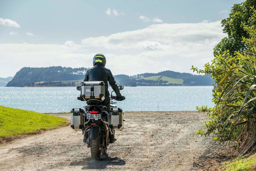 Triumph Tiger 1200 Rally Pro riding on gravel road