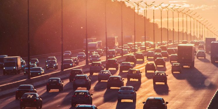 traffic on motorway at sunset