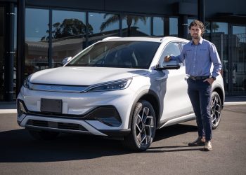 Man standing next to BYD Atto 3 at Keith Andrews dealership in Whangarei