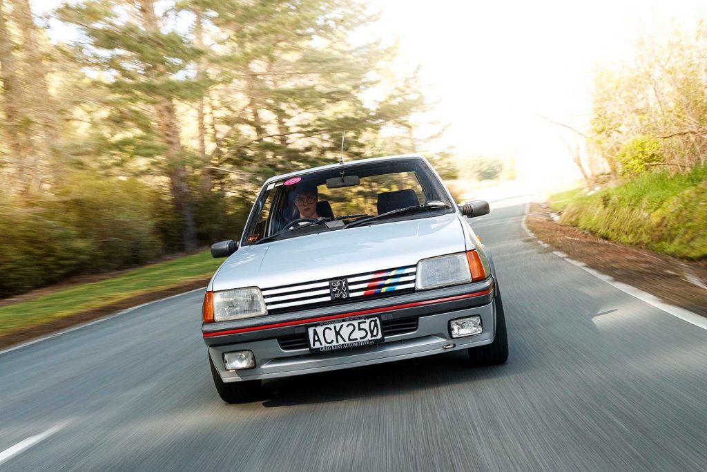 Peugeot 205 GTi driving through trees