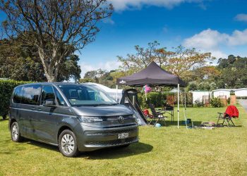 Volkswagen Multivan Family PHEV parked in front of tent