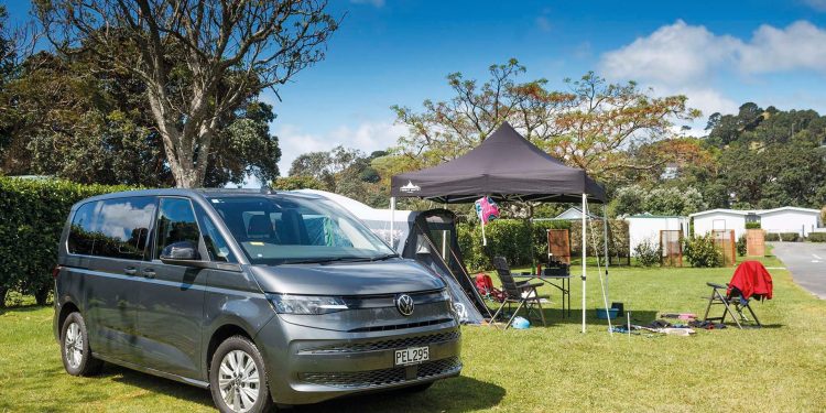 Volkswagen Multivan Family PHEV parked in front of tent