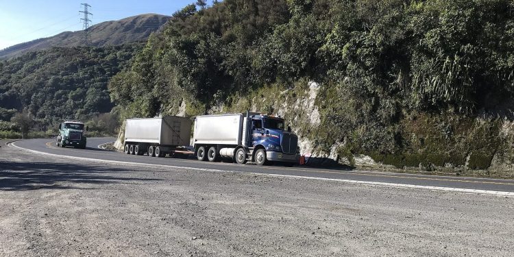Trucks driving up hill in New Zealand