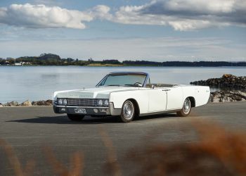 1967 Lincoln Continental Convertible in front of water