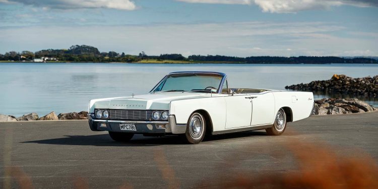 1967 Lincoln Continental Convertible in front of water