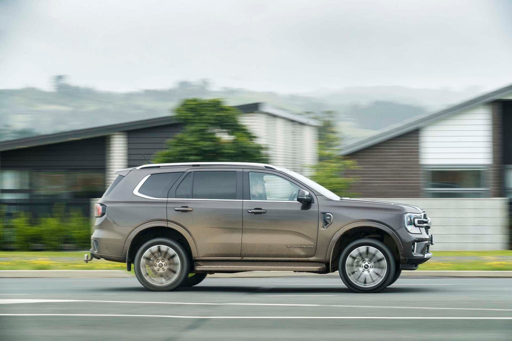 Ford Everest Platinum driving past houses