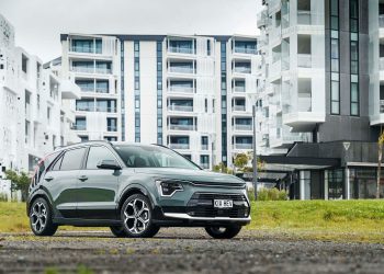 Kia Niro Hybrid GT-Line in front of apartments
