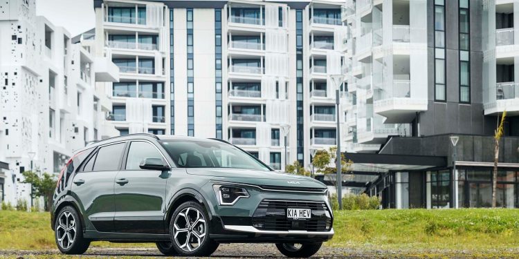 Kia Niro Hybrid GT-Line in front of apartments