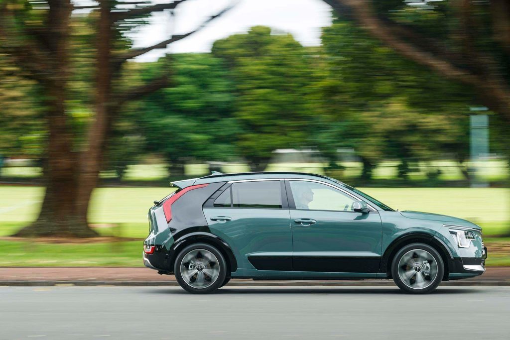 Kia Niro Hybrid GT-Line driving past trees