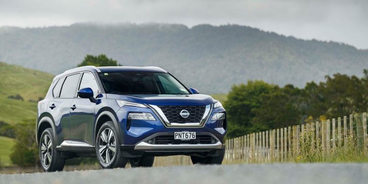 Nissan X-Trail Ti-L with mountains in background