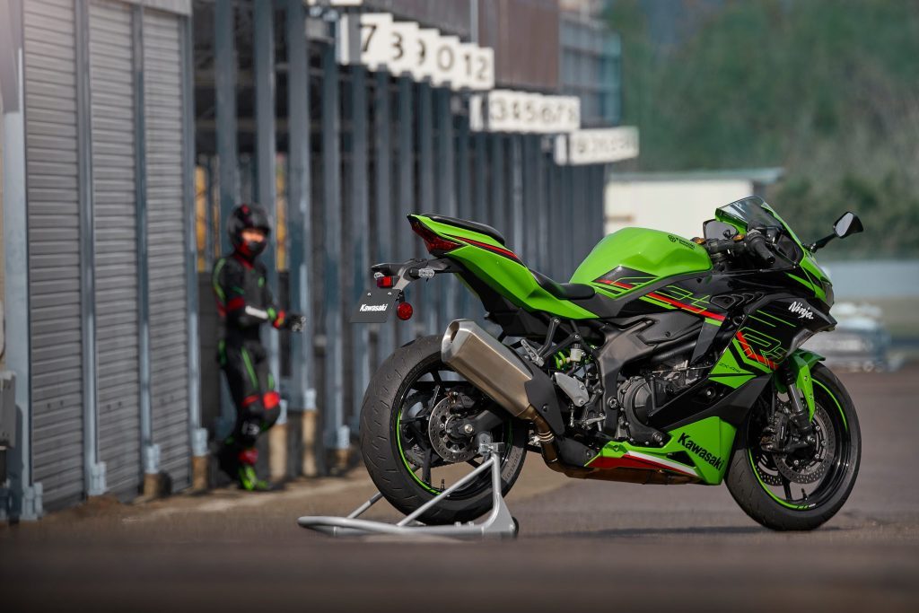 Kawasaki Ninja ZX-4R with rider in background