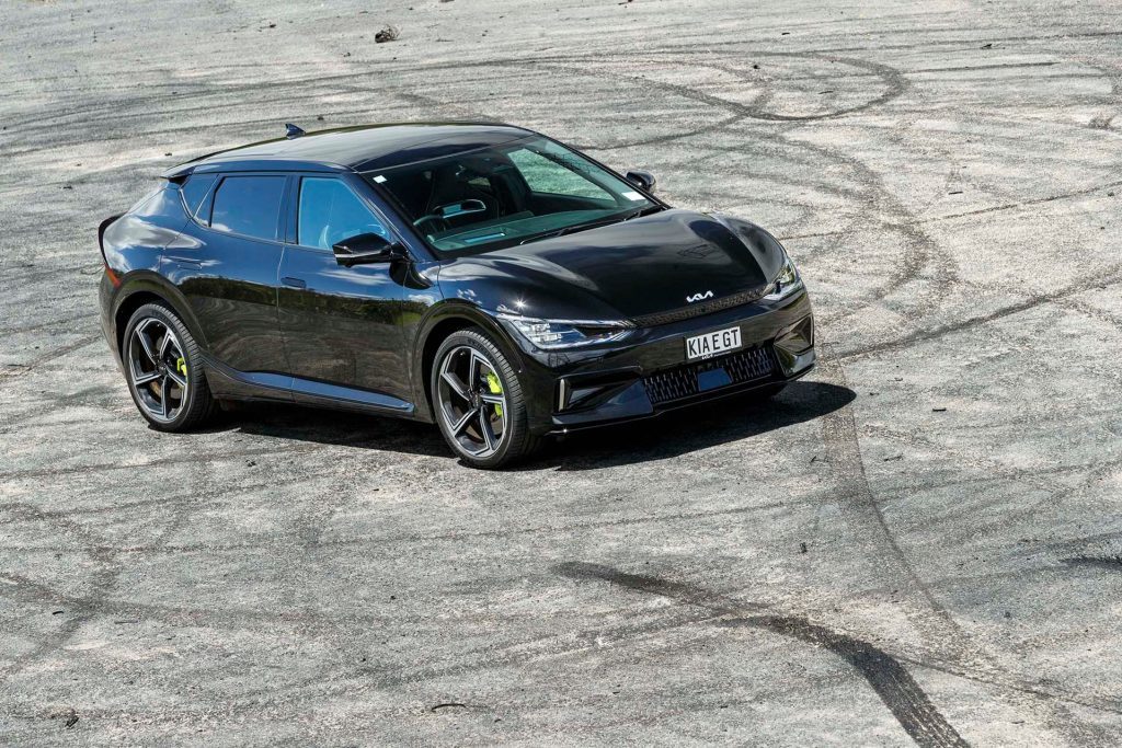 Kia EV6 GT surrounded by tyre marks