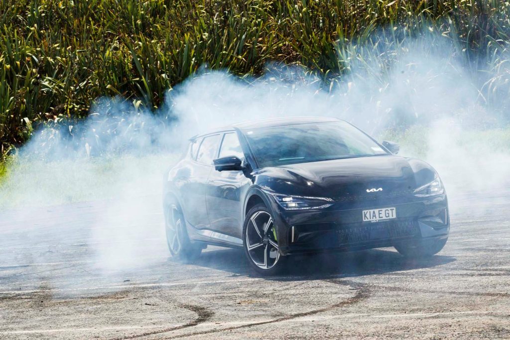 Kia EV6 GT surrounded by smoke