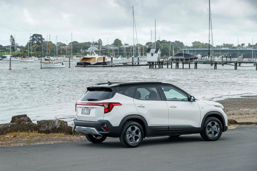 Kia Seltos LX parked in front of boats