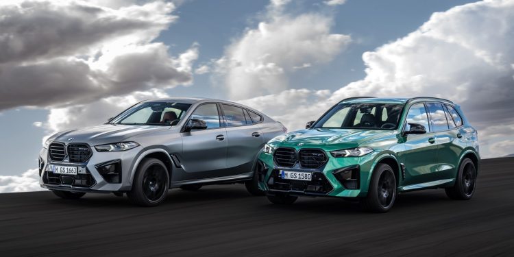 BMW X5 and X6 M Competition driving on road