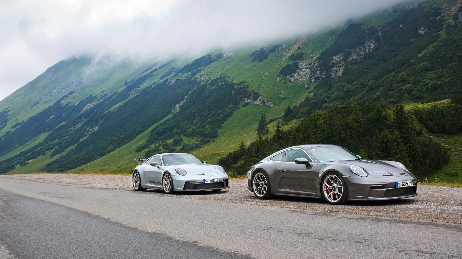 Porsche GT3s on mountain pass road