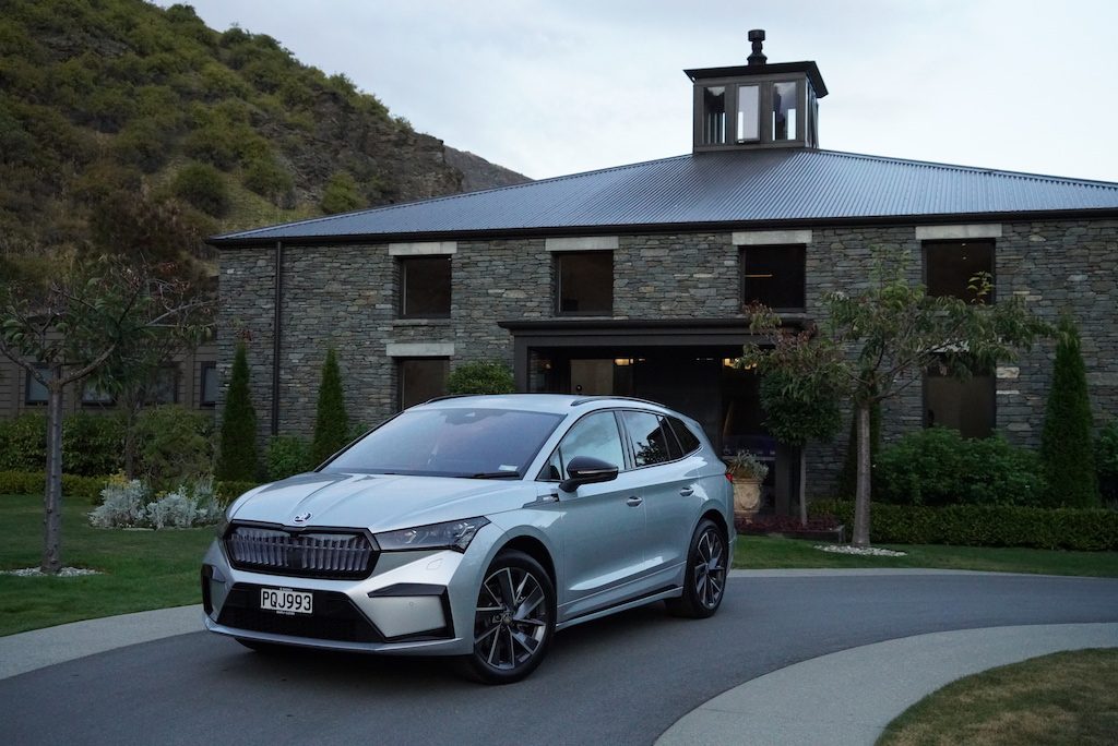Skoda Enyaq in front of stone building