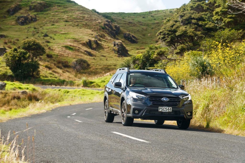 Subaru Outback XT driving on road