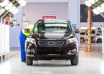 Used Toyota being inspected by technician