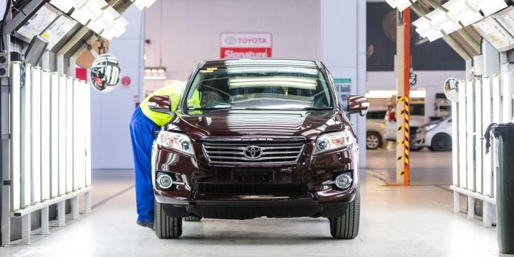 Used Toyota being inspected by technician