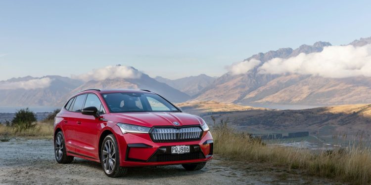 Skoda Enyaq with mountains in background