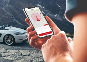 Person using ROADS by Porsche app on phone