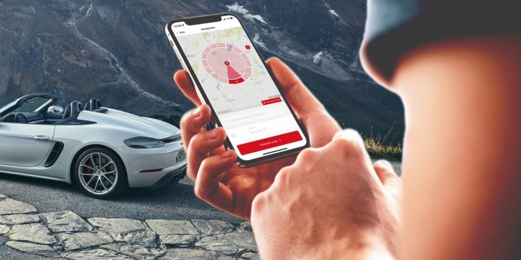 Person using ROADS by Porsche app on phone