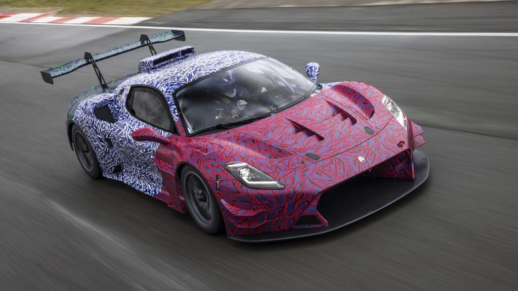 Maserati MC20 GT2 front three quarter view driving on track