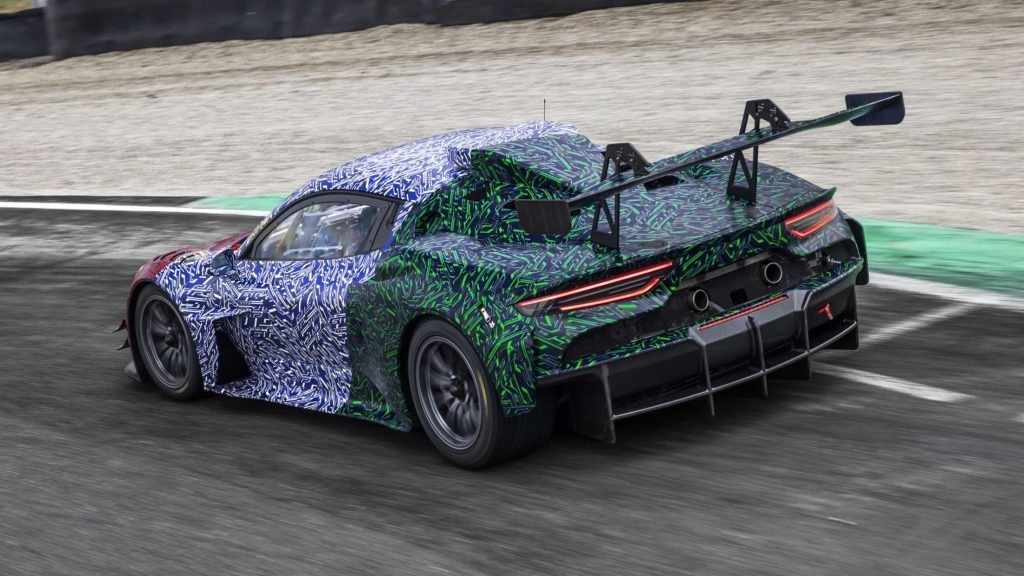 Maserati MC20 GT2 rear three quarter view driving on track