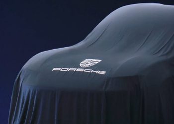 Covered fully electric Porsche SUV