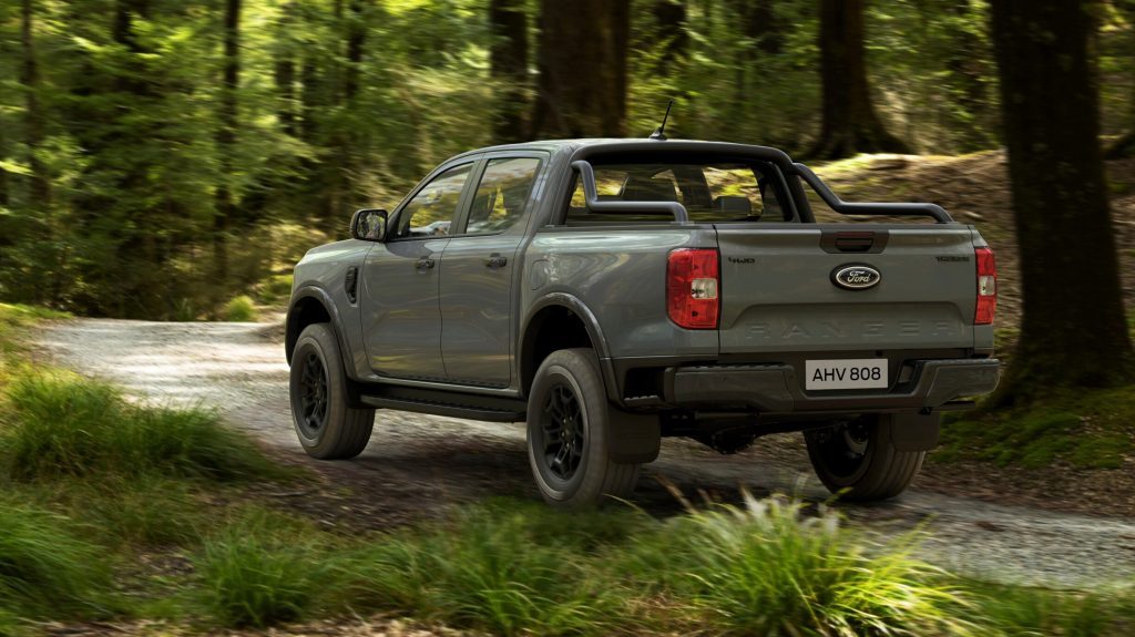 Ford Ranger Tremor driving through forest rear view