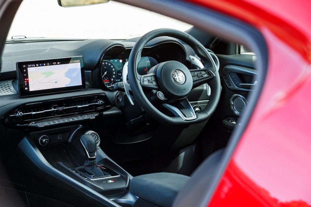 Interior shot with dash and steering wheel inside Alfa Romeo Tonale Veloce