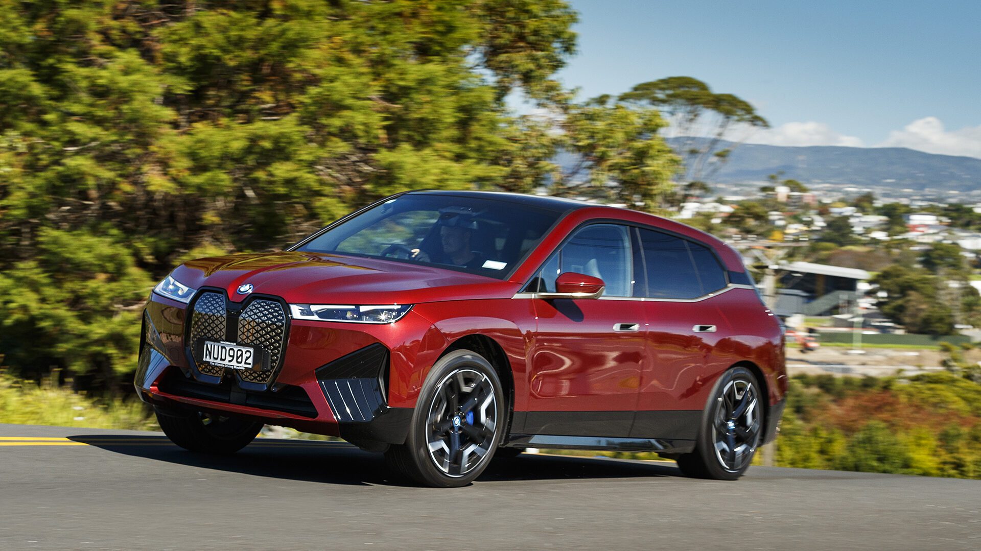 BMW iX driving front three quarter view