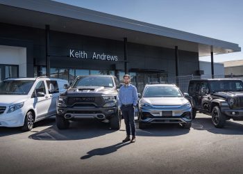 Man standing with RAM, BYD, Jeep and Mercedes