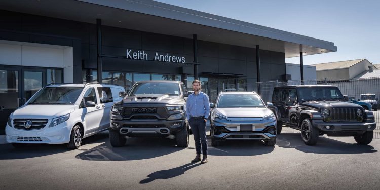 Man standing with RAM, BYD, Jeep and Mercedes