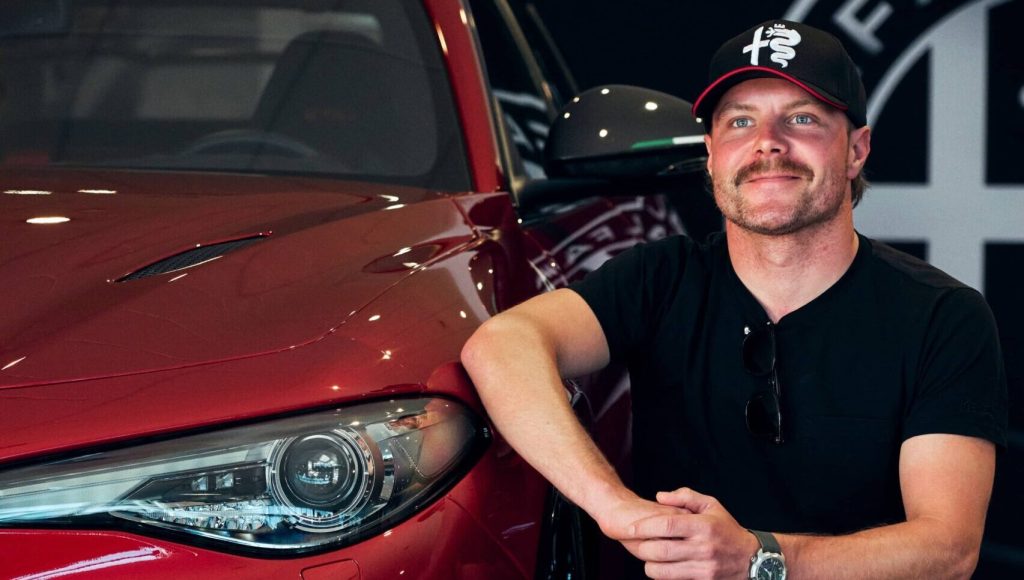 Alfa Romeo F1 Team driver kneeling next to his new Giulia GTAm