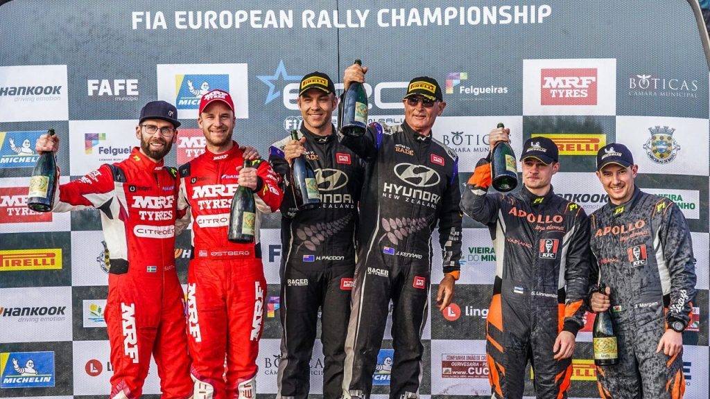 Hayden Paddon and John Kennard on podium celebrating Rally Fafe win 2023