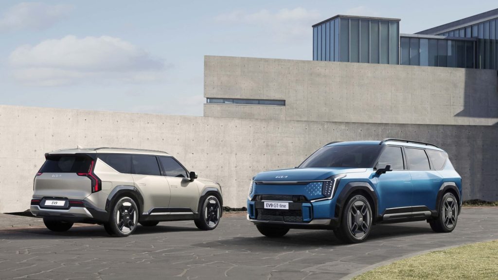 Two Kia EV9s side by side, front and back three quarter views