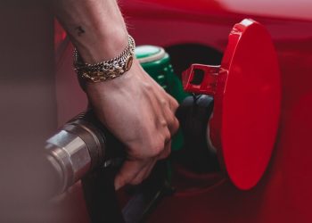 Person filling car up with petrol