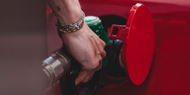 Person filling car up with petrol