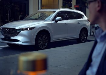 Mazda CX-8 facelift parked on road outside of restaurant